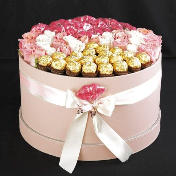 A rose chocolate box filled with multi color roses and ferrero rocher chocolate