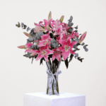 7 stems of pink lilies in vase