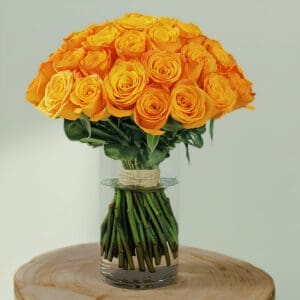 A bunch of orange roses in vase