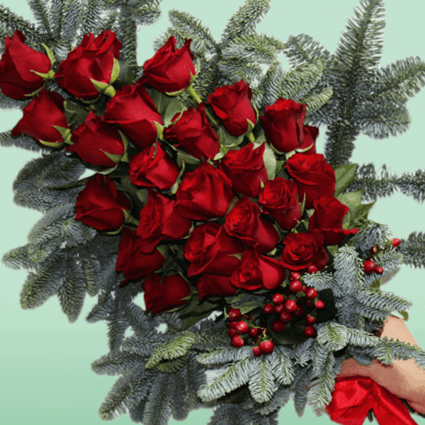 Christmas Hand Bouquet – Elegant festive bouquet featuring fresh seasonal flowers with holiday-inspired wrapping, perfect for Christmas gifting, celebrations, and winter décor.