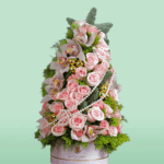 Christmas Present in Elegant Pink Gift Box with Festive Floral Arrangement and Holiday Decor