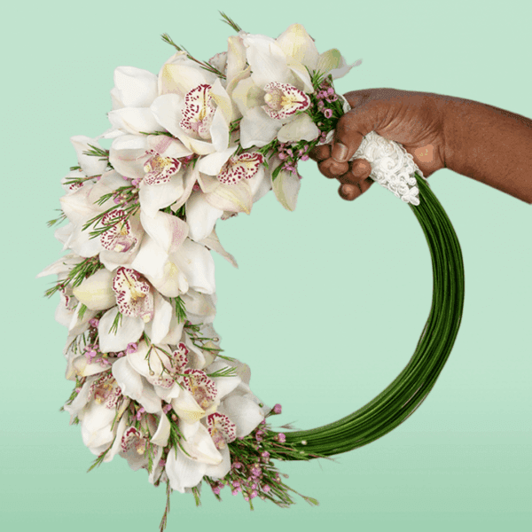 Dazzling bridal flower bouquet with elegant fresh blooms arranged for weddings, featuring romantic floral details and a graceful hand-tied design perfect for brides and special occasions.