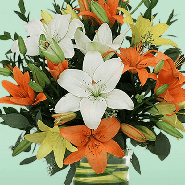 Mix Lily in Vase arrangement with fresh pink and white lilies elegantly displayed in a clear glass vase, perfect for home décor, celebrations, and thoughtful flower gifting.