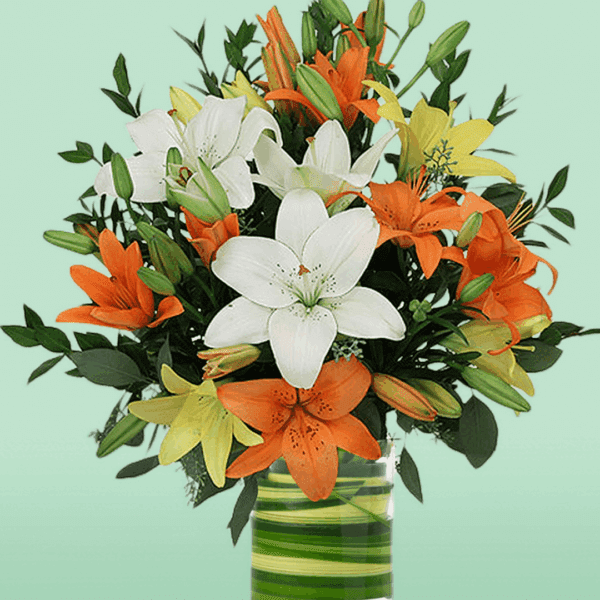Mix Lily in Vase arrangement with fresh pink and white lilies elegantly displayed in a clear glass vase, perfect for home décor, celebrations, and thoughtful flower gifting.