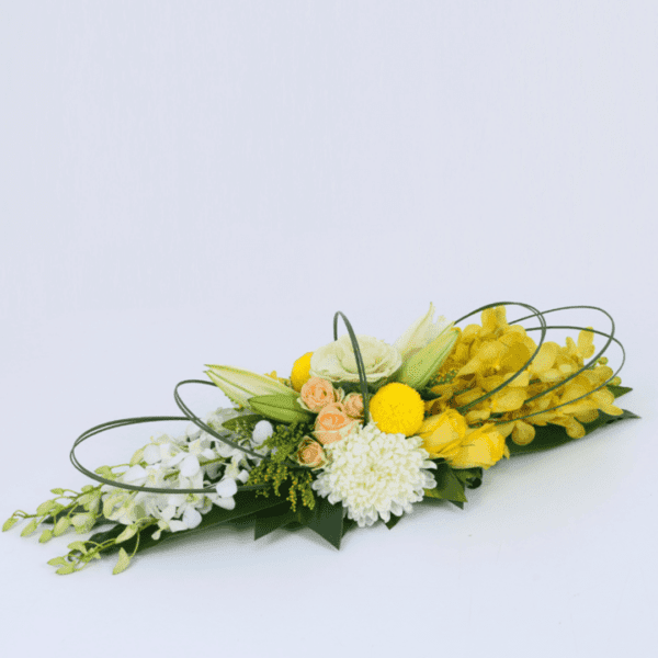 Long and low arrangement - Yellow Theme | Blacktulipflowers.in