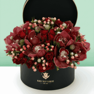 Christmas special gift box arrangement featuring elegant white cymbidium orchids with festive seasonal styling, beautifully arranged in a premium gift box for holiday celebrations, gifting, and winter floral decor.