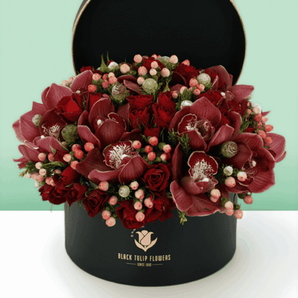 Christmas special gift box arrangement featuring elegant white cymbidium orchids with festive seasonal styling, beautifully arranged in a premium gift box for holiday celebrations, gifting, and winter floral decor.