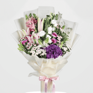 Elegant hydrangea and lily bouquet wrapped in tissue floral wrap accompanied by chrysanthemum, carnation and snapdragon.