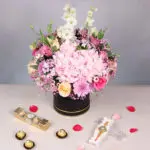 Gemstone Rakhi with Flowers Arrangement and Chocolate Treat