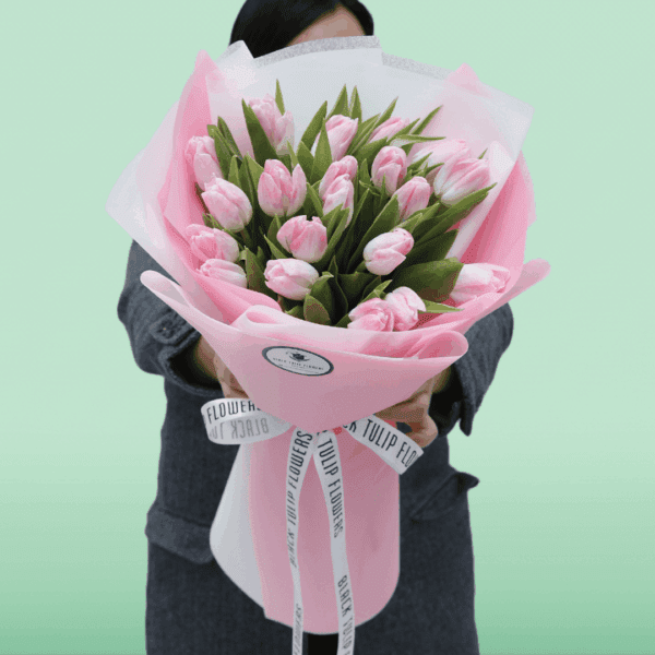 Elegant 20 light pink tulips bouquet wrapped in soft pink tissue floral wrap