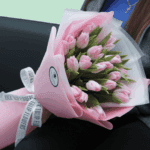 Elegant 20 light pink tulips bouquet wrapped in soft pink tissue floral wrap