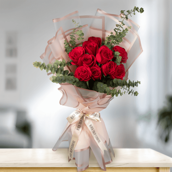 My Love A stunning 15 red roses bouquet, arranged in a brownish cellophane sheet and tied with light pink ribbon