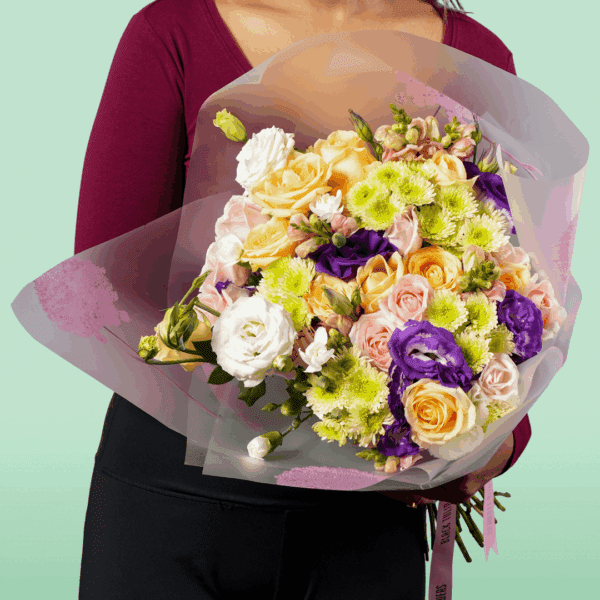 Colourburst Floral Symphony bouquet arrangement with vibrant roses, lilies, carnations, and seasonal blooms in a colorful luxury floral display.