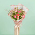 Small 6 pink tulips bouquet with berry accents wrapped in cellophane