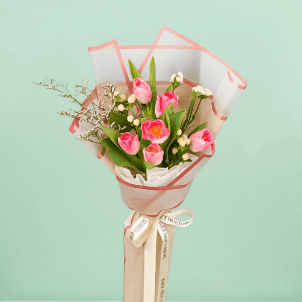 Tulip In Basket (2) Small 6 pink tulips bouquet with berry accents wrapped in cellophane