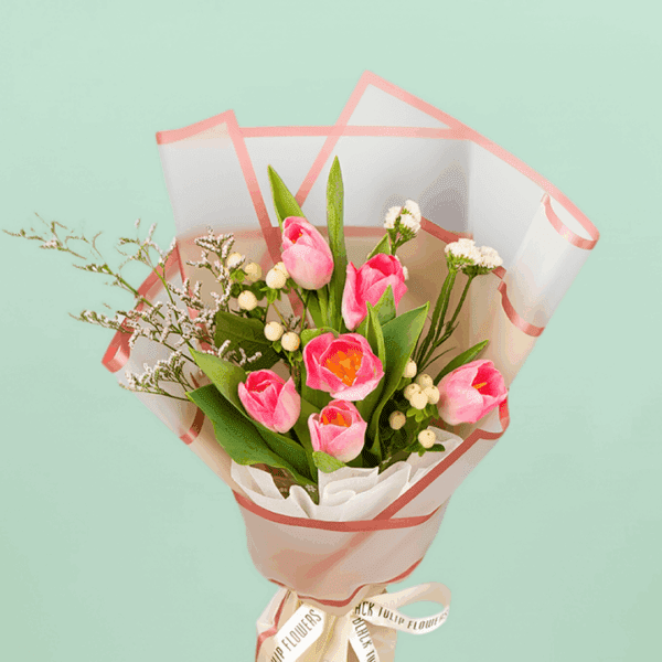 Tulip In Basket (3) Small 6 pink tulips bouquet with berry accents wrapped in cellophane