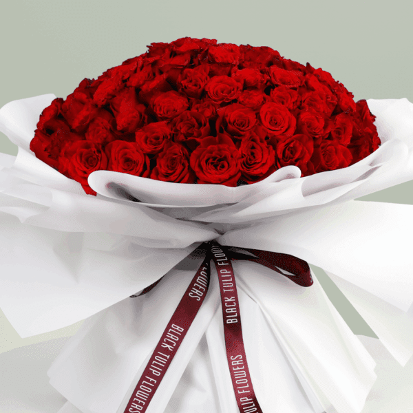 Heartfelt bouquet of red roses tied with a satin ribbon.