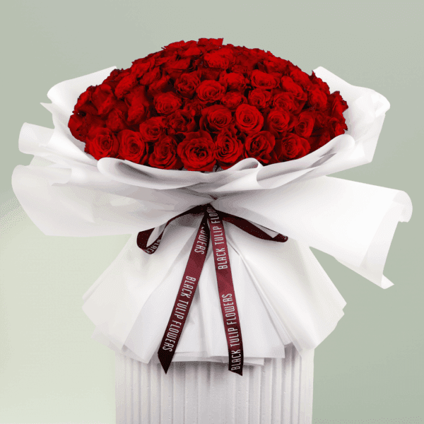 Heartfelt bouquet of red roses tied with a satin ribbon.