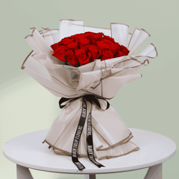 Red Rose Bouquet (2) A bouquet of vibrant red roses wrapped beautifully for Valentine's Day. Order red rose bouquet