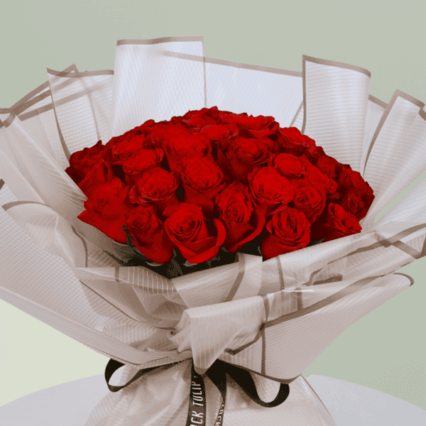 Red Rose Bouquet (3) A bouquet of vibrant red roses wrapped beautifully for Valentine's Day. Order red rose bouquet