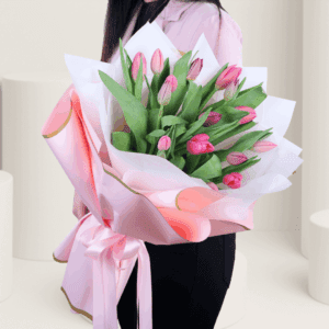 A vibrant bouquet of 15 pink tulip stems, available for online purchase.