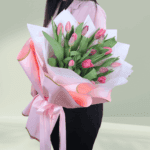 A vibrant bouquet of 15 pink tulip stems, available for online purchase.