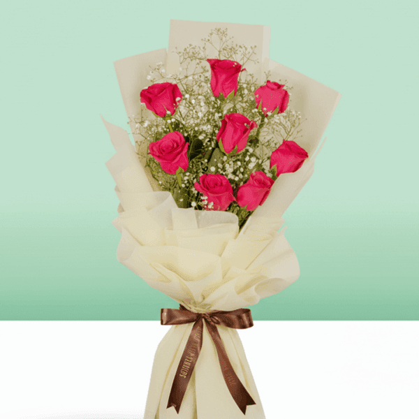 Soft blush roses arranged with eucalyptus foliage creating a dreamy and romantic floral bouquet.