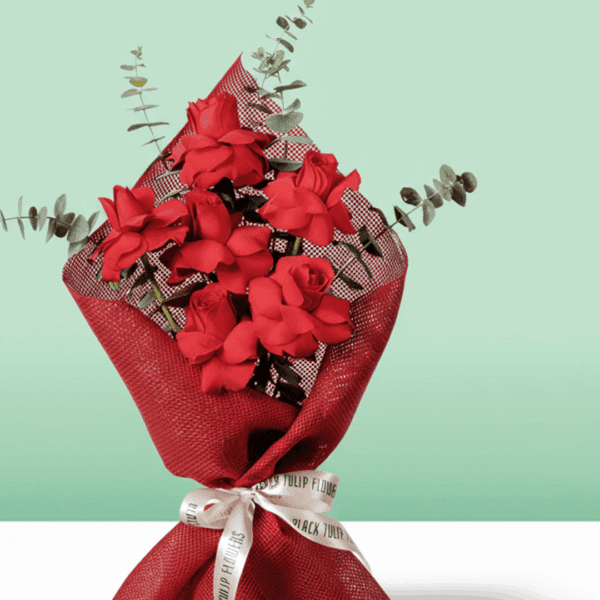 A Beautiful bouquet of 6 red rose tied up with white ribbon