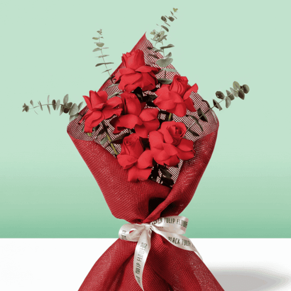 A Beautiful bouquet of 6 red rose tied up with white ribbon