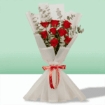 Romantic arrangement of 8 red roses in rich crimson tones, perfect for special moments.