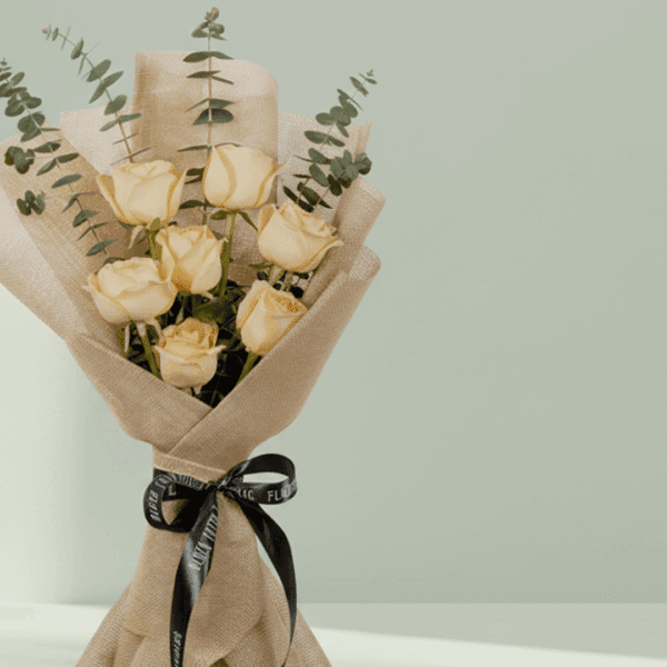 Blush bouquet of 6 peach roses with eucalyptus, wrapped in elegant non-woven fabric.