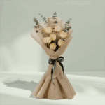 Blush bouquet of 6 peach roses with eucalyptus, wrapped in elegant non-woven fabric.