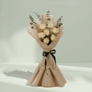 Blush bouquet of 6 peach roses with eucalyptus, wrapped in elegant non-woven fabric.