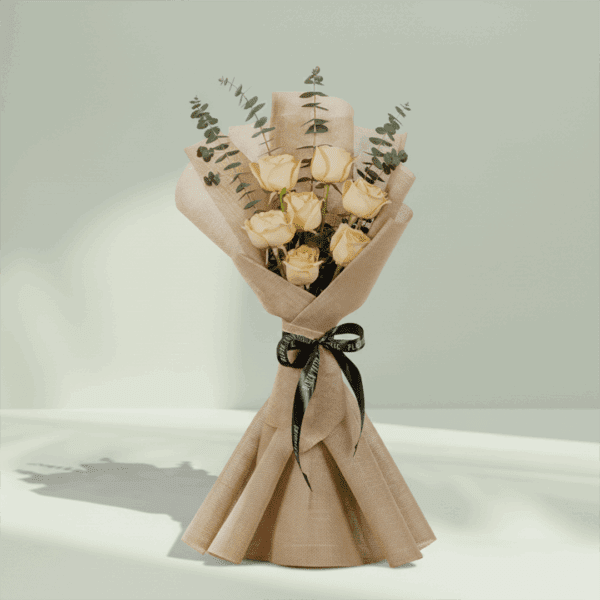 Blush bouquet of 6 peach roses with eucalyptus, wrapped in elegant non-woven fabric.