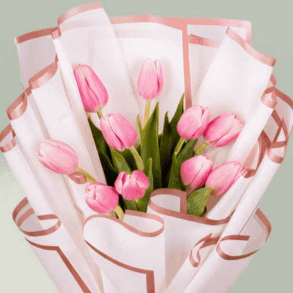 10 pink tulips bouquet wrapped in white Korean flower paper with pink ribbon