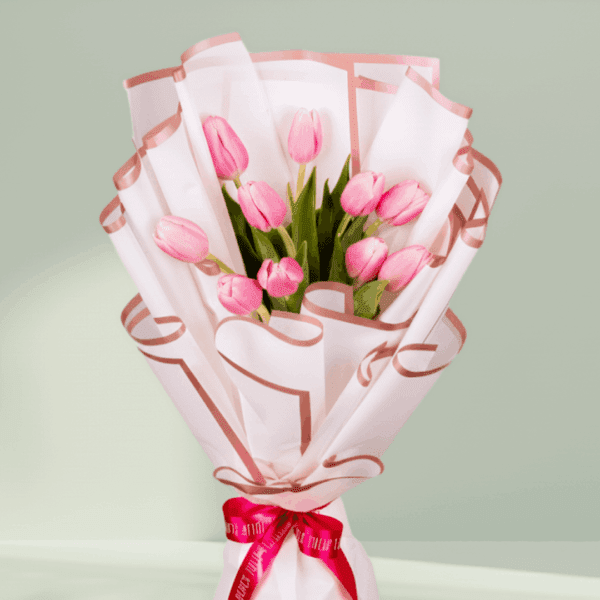 10 pink tulips bouquet wrapped in white Korean flower paper with pink ribbon