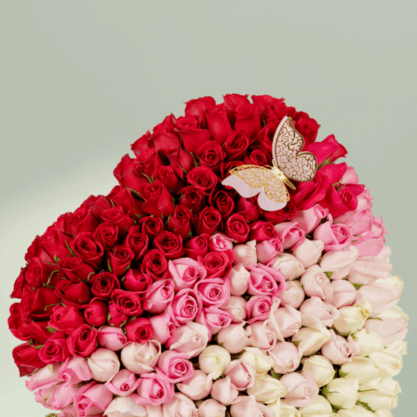 Bouquet of 120 assorted roses with moss grass on a wooden heart-shaped base