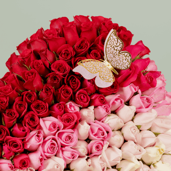 Bouquet of 120 assorted roses with moss grass on a wooden heart-shaped base