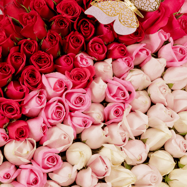 Bouquet of 120 assorted roses with moss grass on a wooden heart-shaped base