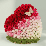 Bouquet of 120 assorted roses with moss grass on a wooden heart-shaped base