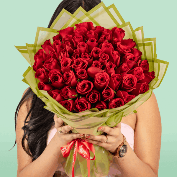 Valentine’s bouquet of 50 red roses wrapped in Korean-style flower sheets with an 'I Love You' topper