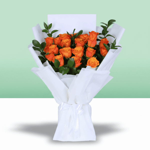 Hand-tied orange rose flower bouquet styled with white wrapping and printed message card saying 'thinking of you'