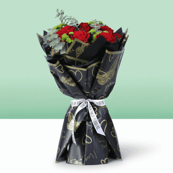 Red mixed flower bouquet with roses, chrysanthemums and eucalyptus wrapped in Korean style sheets with golden "Love You" topper