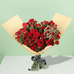 A luxurious arrangement of vibrant red roses, beautifully gathered and wrapped in non-woven paper.
