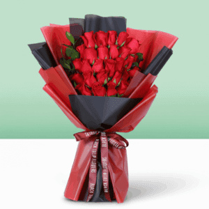 Fresh red roses arranged in a compact bouquet, wrapped in a black and red sheet and tied with a red ribbon
