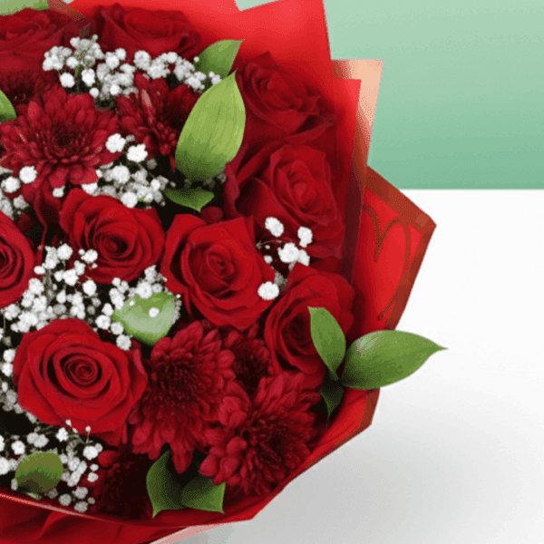"Romantic red floral arrangement with roses, chrysanthemums, green leaves, and a golden “Love You” topper in Korean wrapping. "