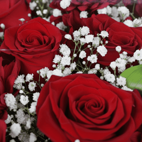 "Romantic red floral arrangement with roses, chrysanthemums, green leaves, and a golden “Love You” topper in Korean wrapping. "