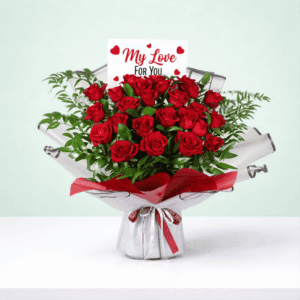 Romantic floral arrangement in rich red tones with fresh greenery, paired with a beautiful red ribbon and a heartfelt “I’m sorry” note.