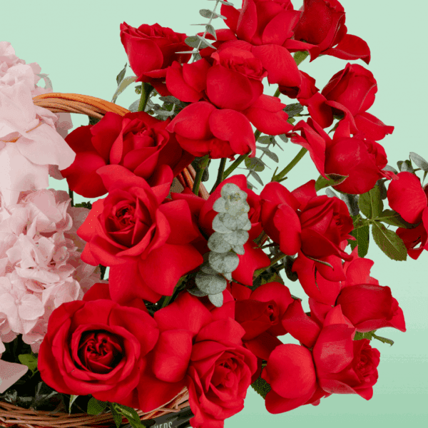 romantic_red_pink_flower_basket (2) Rectangle basket with red and pink roses, hydrangea, and eucalyptus in a soft rosy colour palette