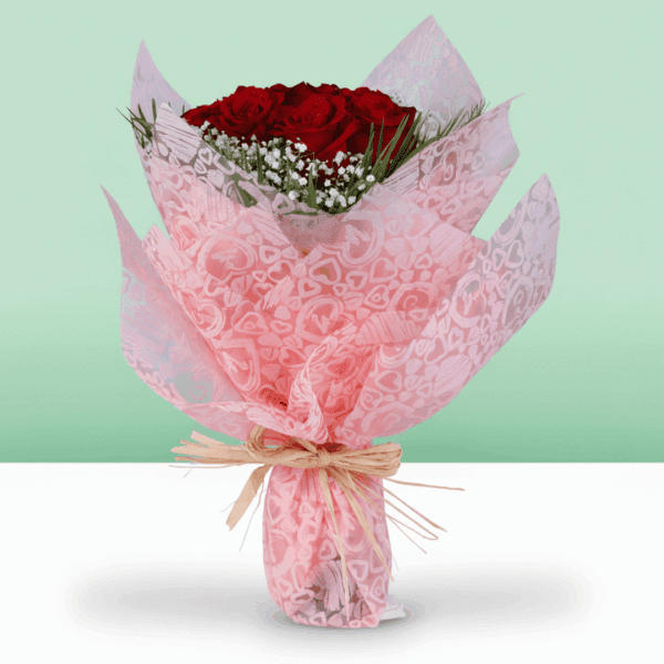 Fresh red roses with soft gypso accents, wrapped in non-woven paper and finished with a golden "Love You" topper